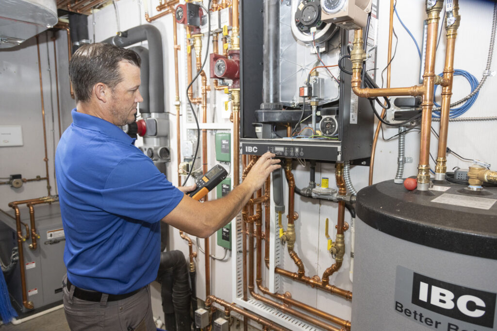 hvac, electrical, & fireplace services in Ellsworth, Wisconsin performed by a Comfort by Design technician